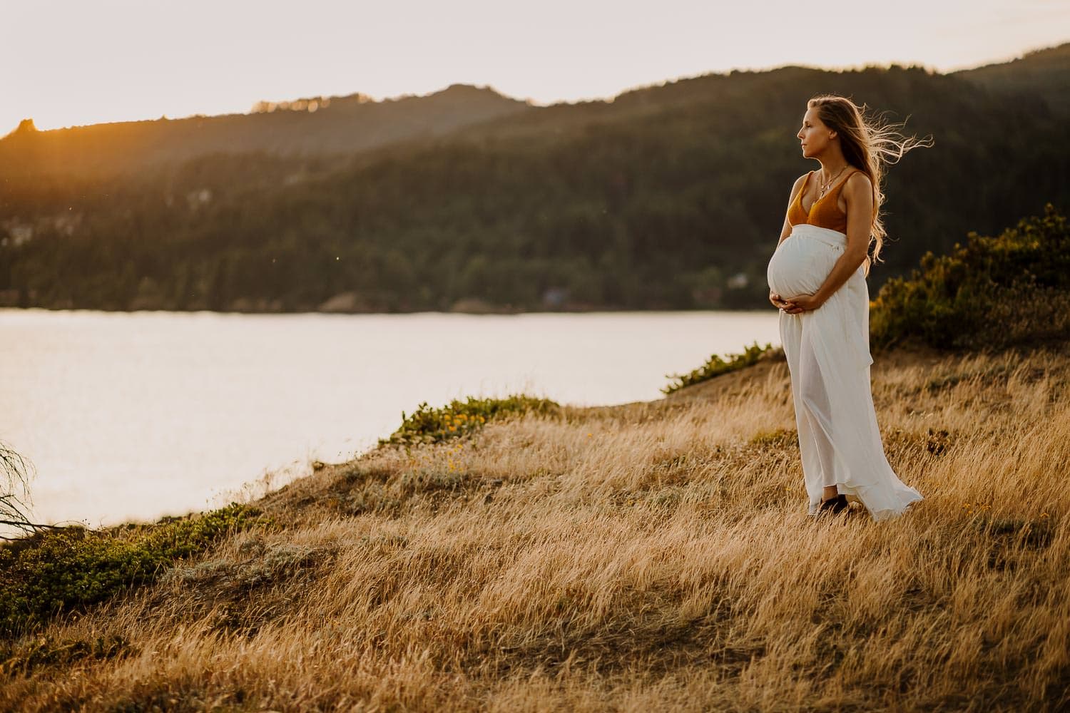 maternity image staring off into sunset