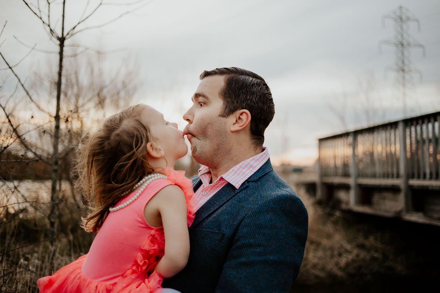 Dad and daughter being silly together making funny faces - outdoor photography