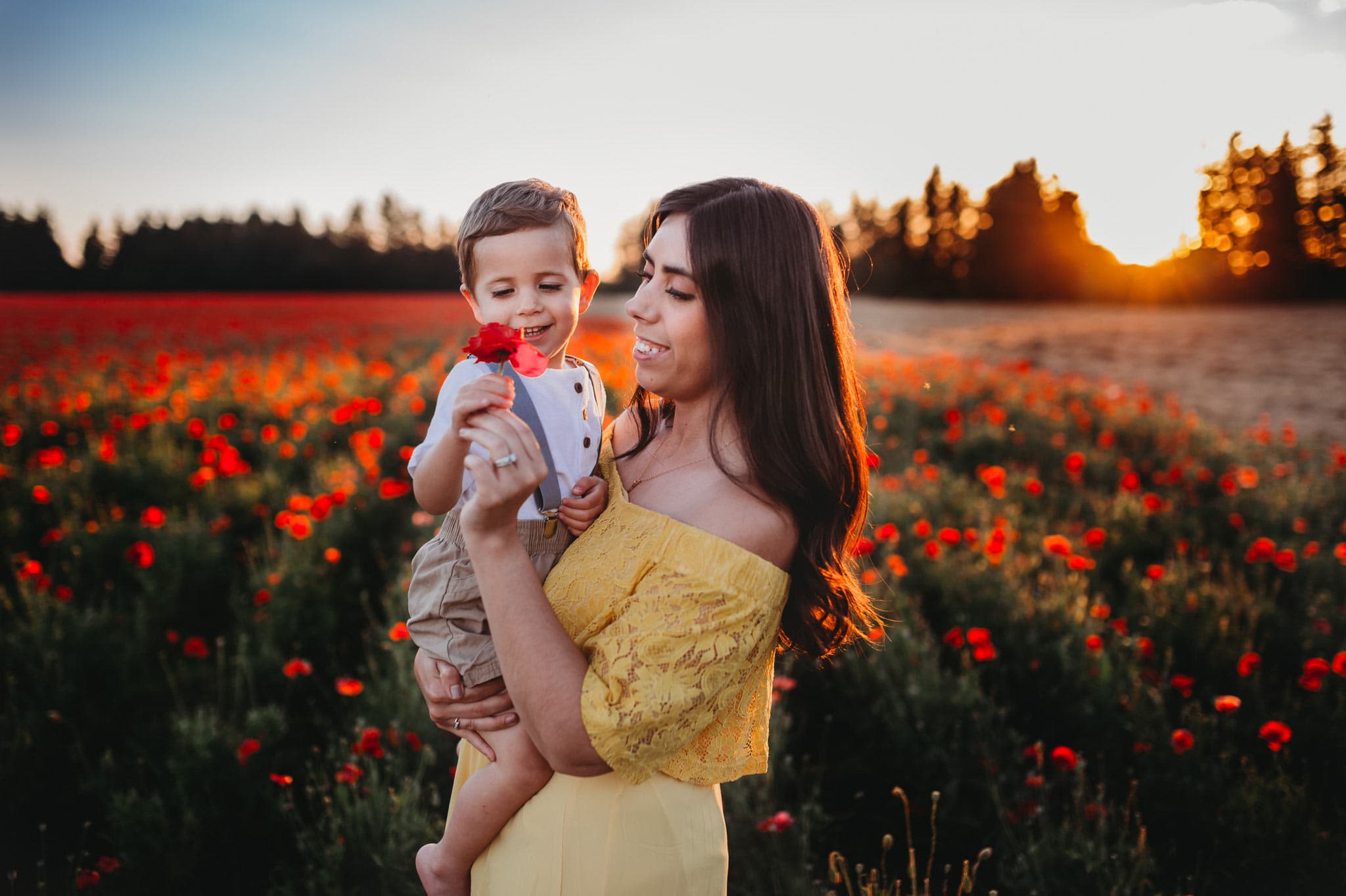 Mom giving poppy to toddler boy in Oregon
