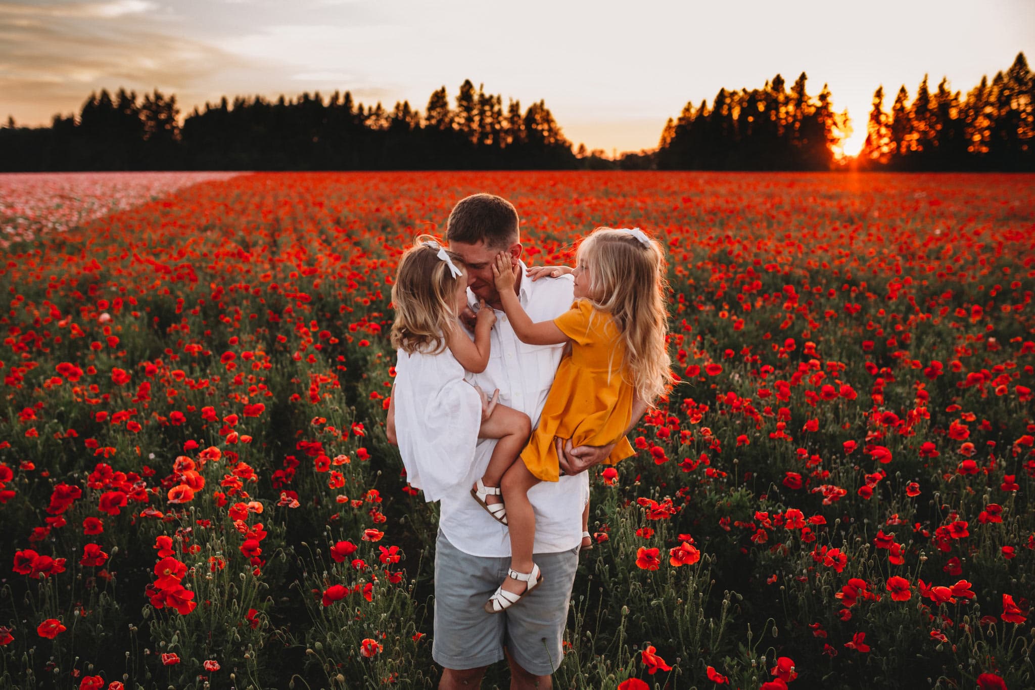 Family standing in Oregon Poppy Fields