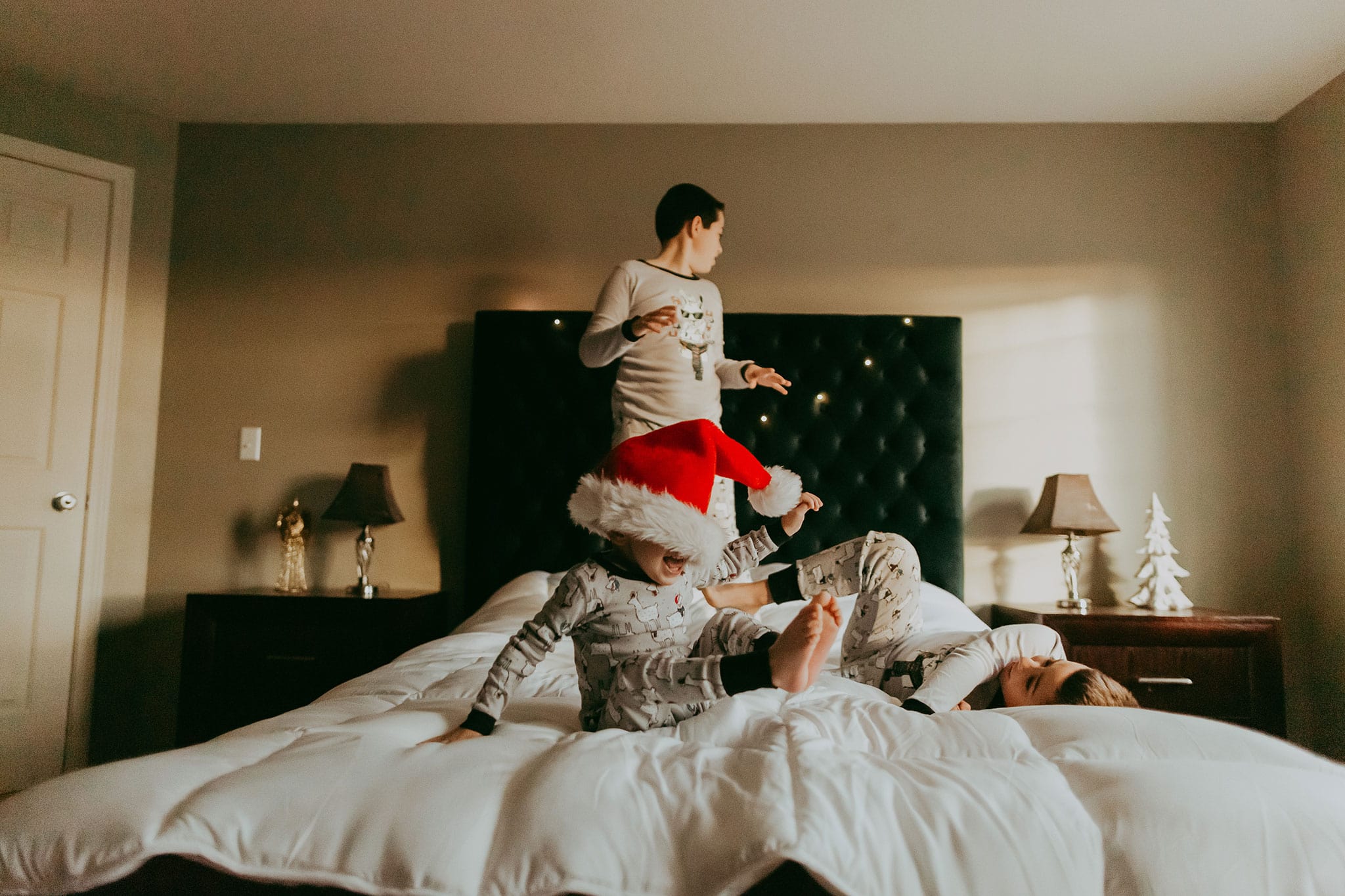 Boys Jumping on the Bed during lifestyle photography session | PDX Photographer