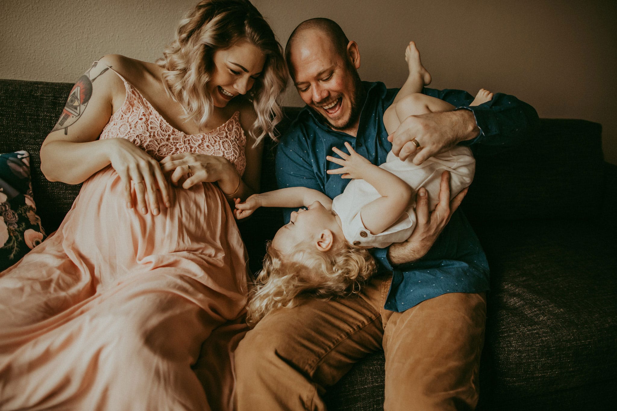fun family photo during in-home maternity photography session in clackamas oregon
