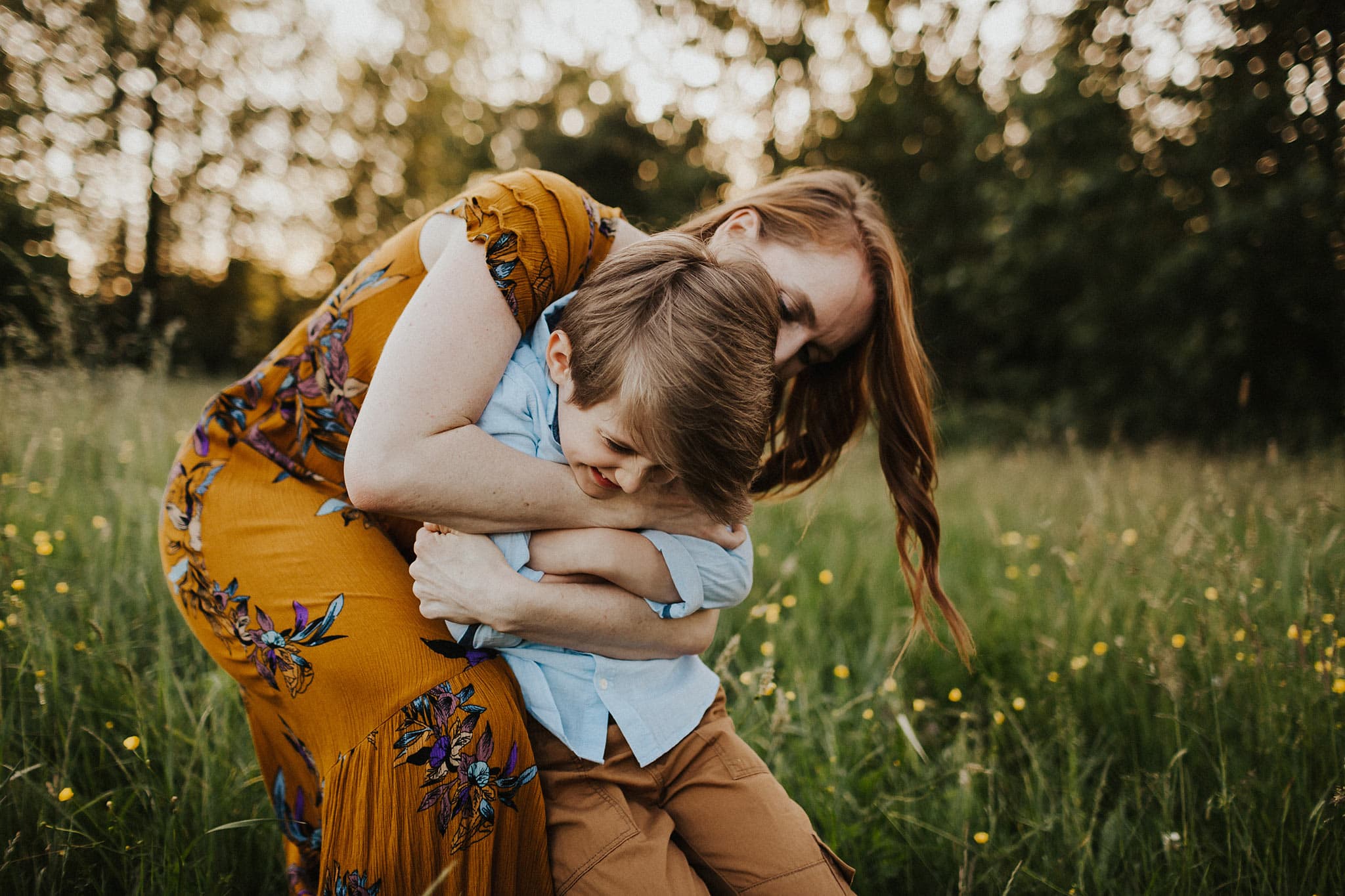 Mom hugging son during family photos