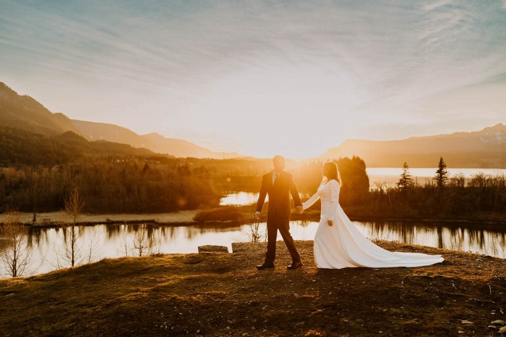 couple walking at sunset in the columbia river gorge