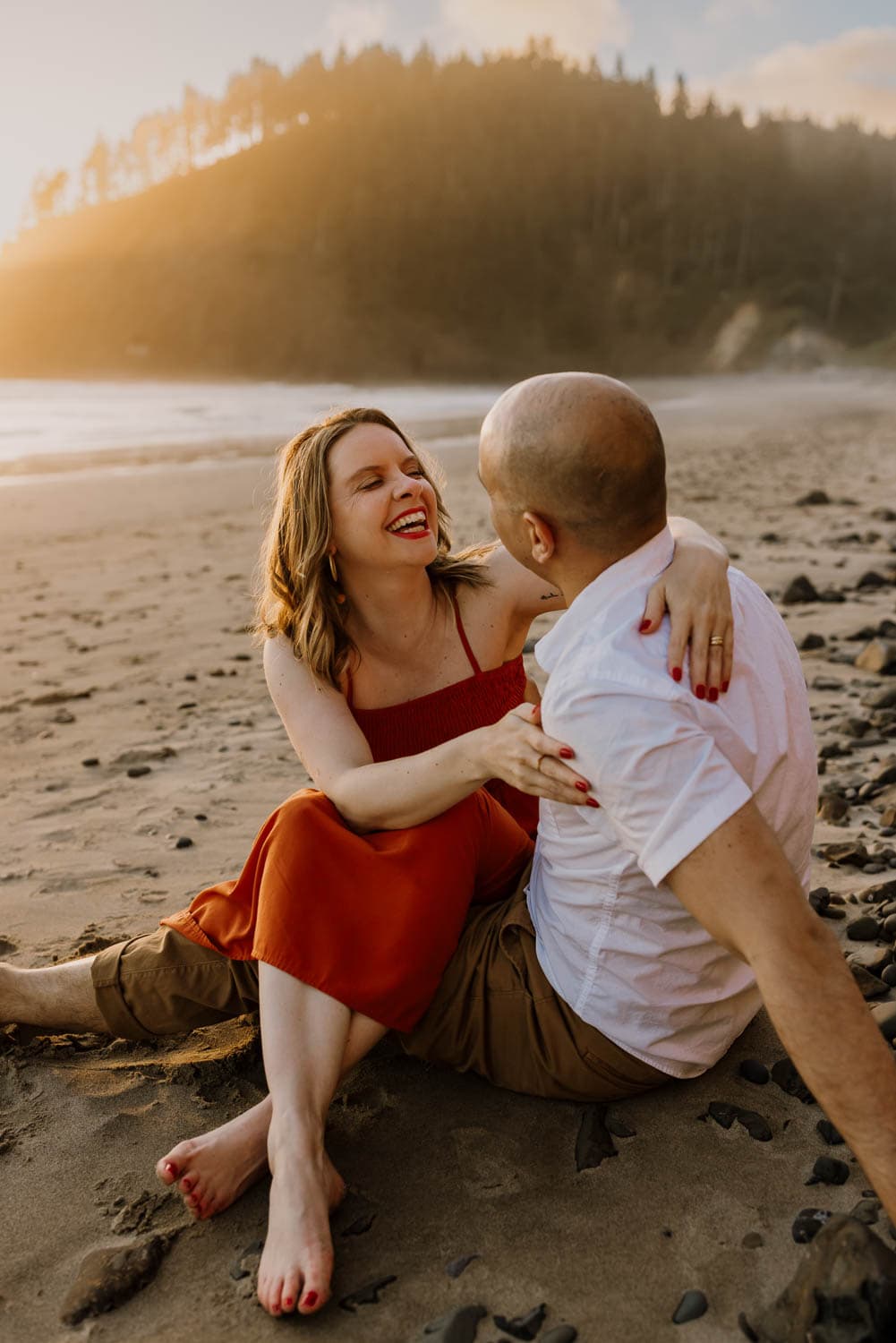 Couple sitting on the sand
