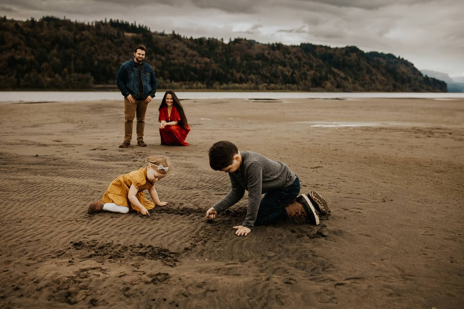 Kids playing in sand while getting their Portland family portraits