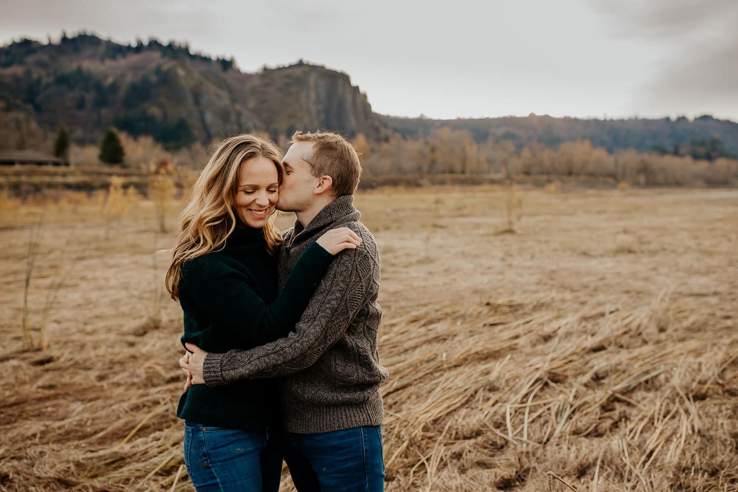 Man kissing womans cheek - best locations for couples sessions