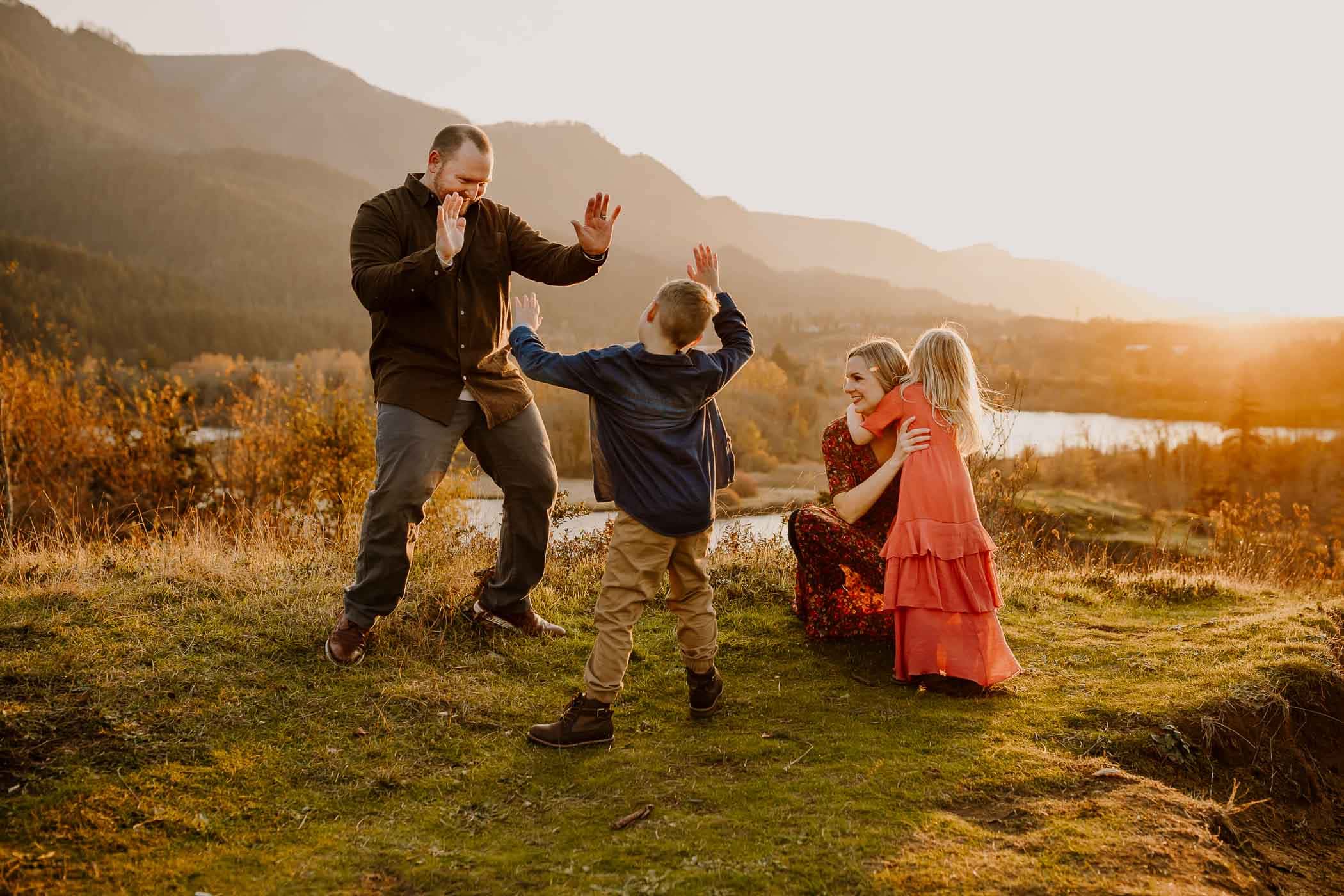 lifestyle photography image of family dancing in the mountains near Portland Oregon