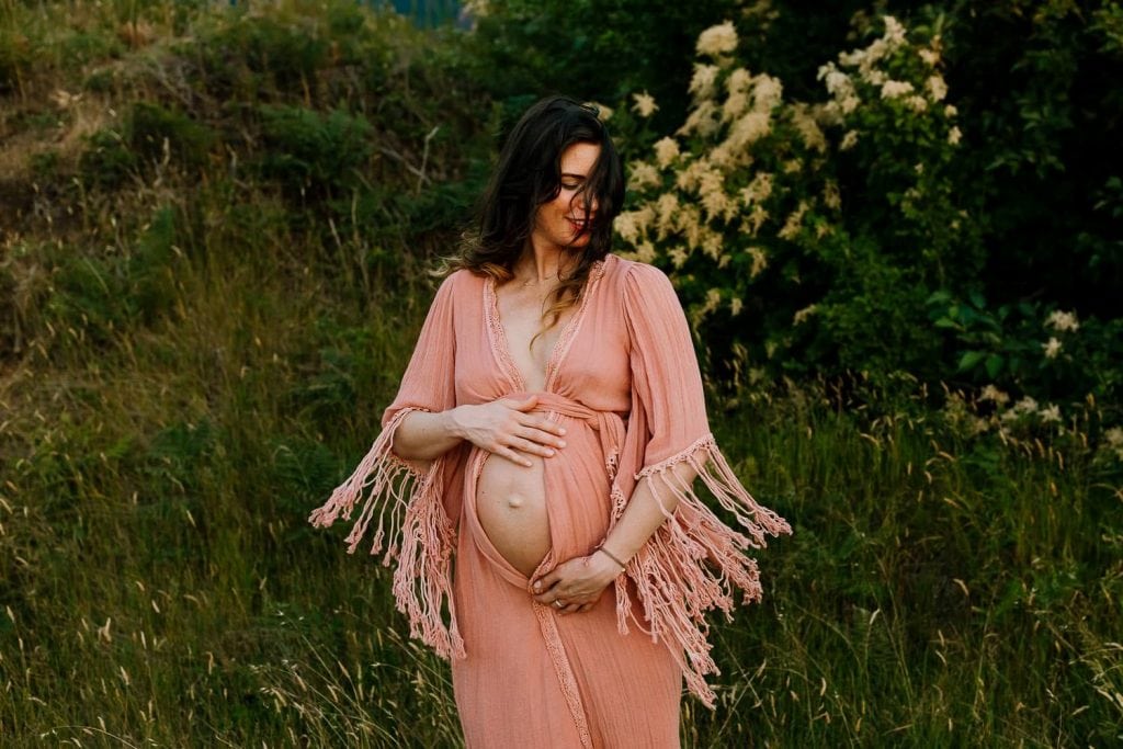 Maternity photo of woman in a Jens Pirate Booty Robe with tassels flying