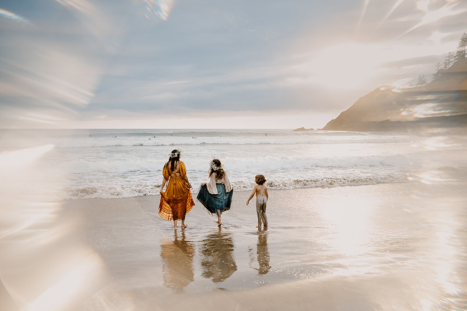Family splashing in the ocean waves near cannon beach