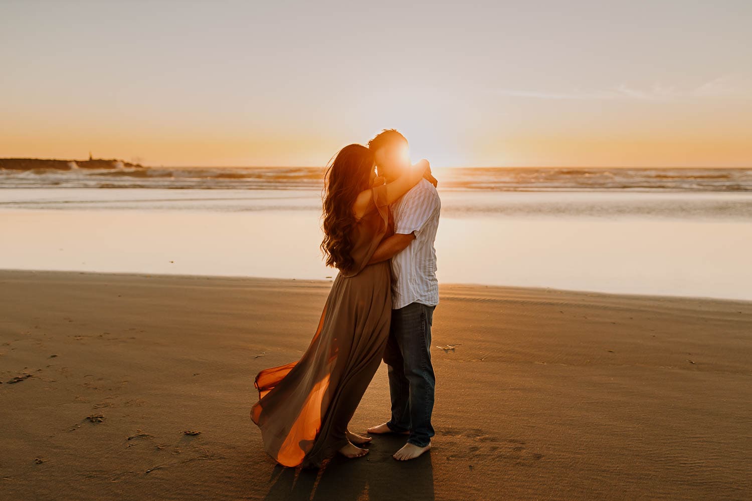 couple at sunset in rockaway beach- beautiful location for engagement photos near portland