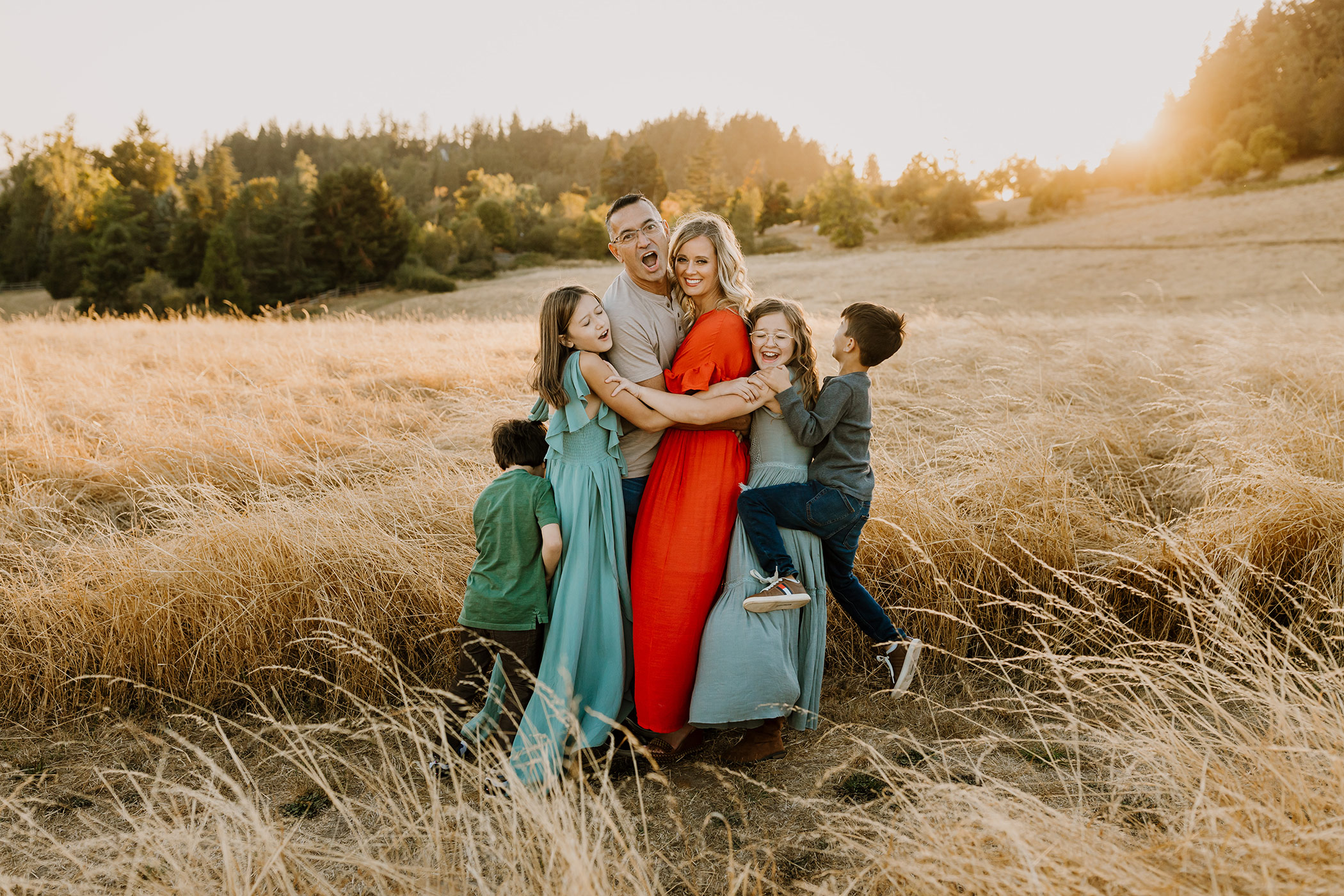Kids running and hugging family - family photo prompts and pose ideas