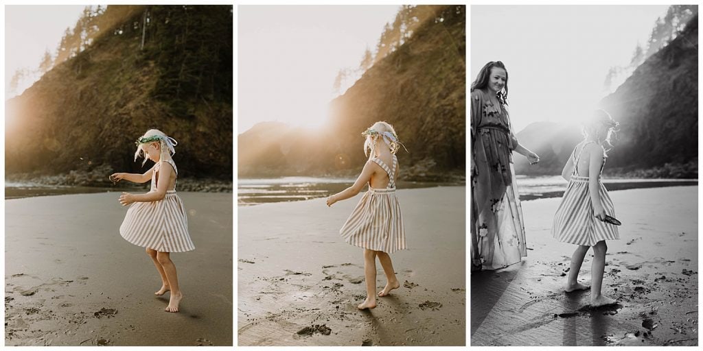 Little girl in a striped dress spinning in the golden sun at Cannon Beach, Oregon