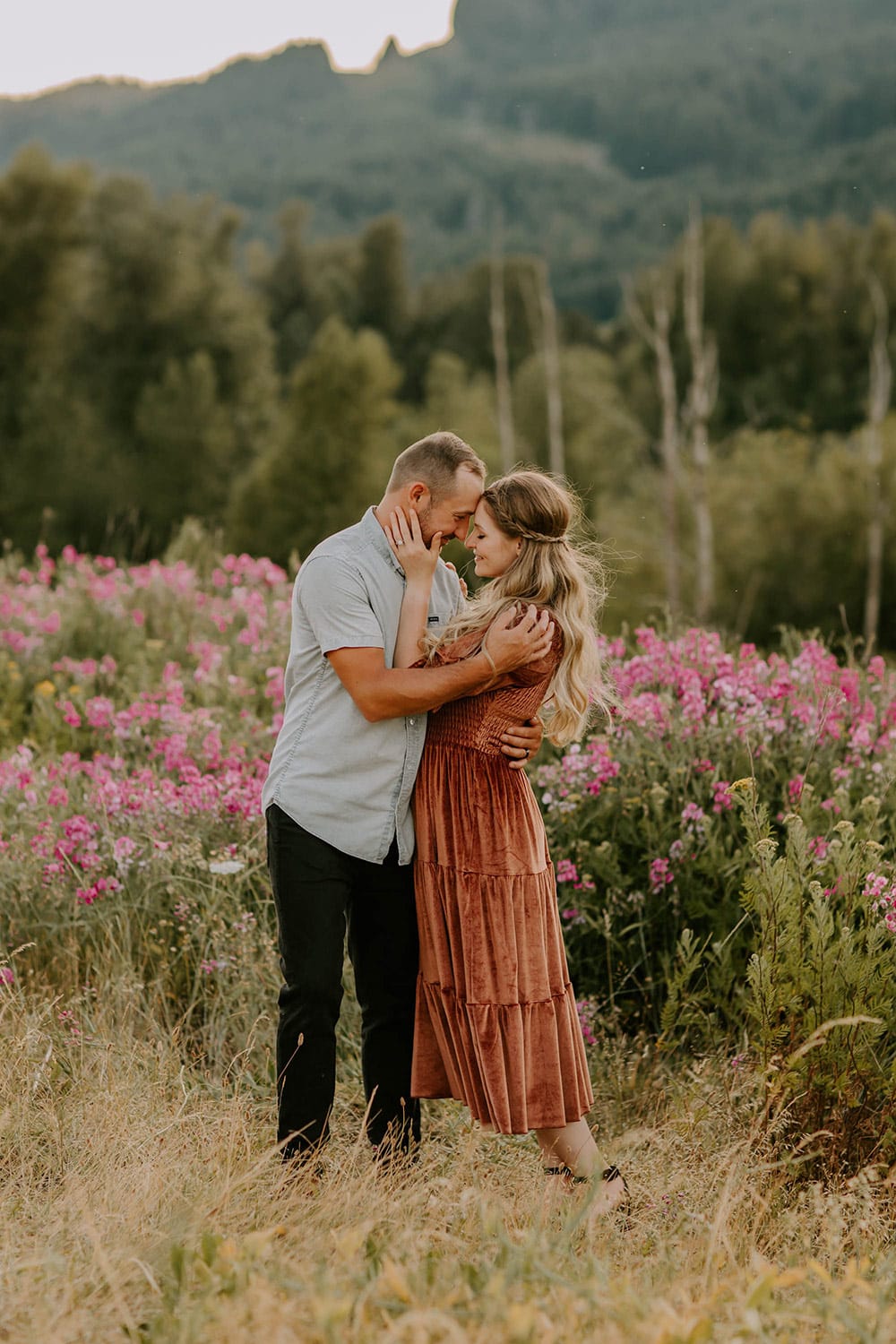 couple embracing in wildflowers