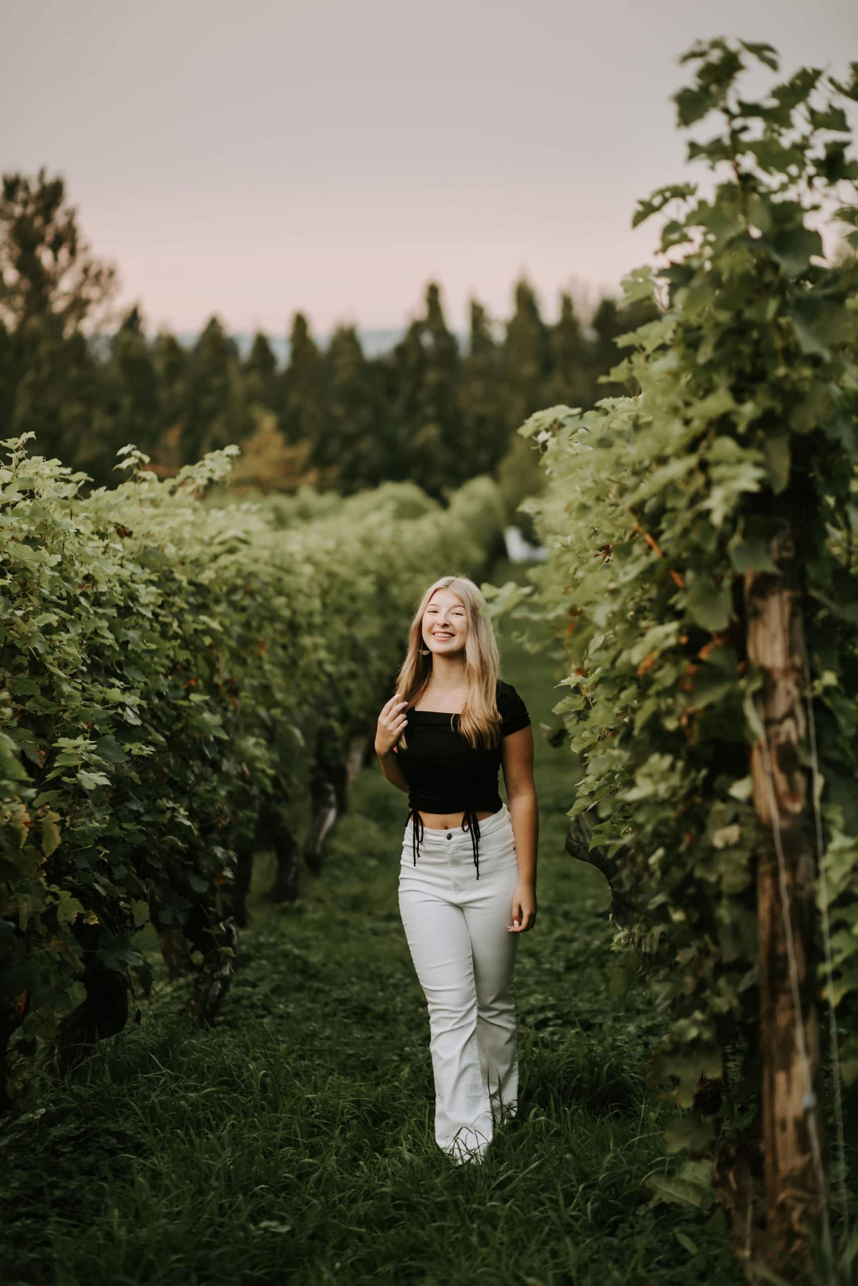 Senior girl walking in a vineyard in vancouver, WA